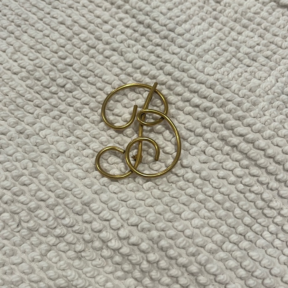 Gold “B” brooch….